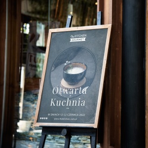 Blackboard sign mockup in front of a restaurant